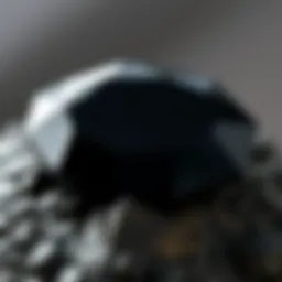 A close-up of a lustrous black gemstone showcasing its unique facets.