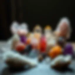 A shimmering collection of various crystals arranged on a wooden surface.