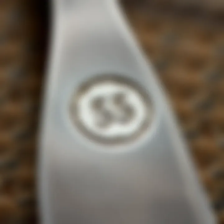 Close-up of a hallmark on a silver piece indicating authenticity