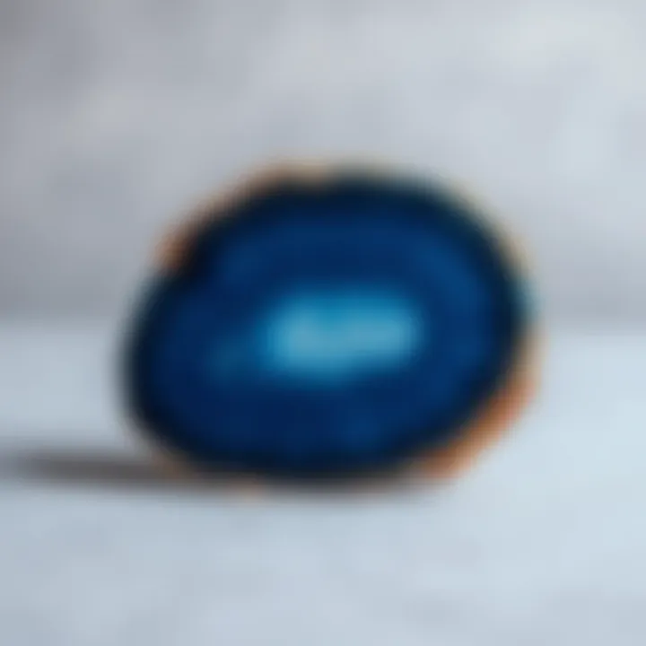 A beautifully polished blue agate slice placed on a neutral background, emphasizing its translucence.