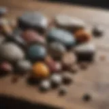 A diverse collection of colorful rocks and stones displayed on a rustic wooden table.