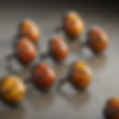 Artistic Display of Bumblebee Jasper Rings A collection of bumblebee jasper rings arranged artistically on a soft fabric
