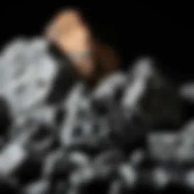 Collection of various types of black glass-like rocks displayed for appreciation