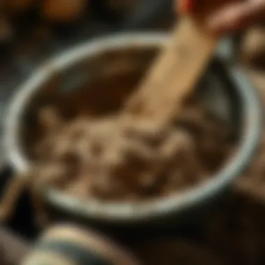 Close-up view of dirt being sifted through a pan