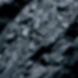 A close-up view of smooth black rock showcasing its shiny surface and unique texture.