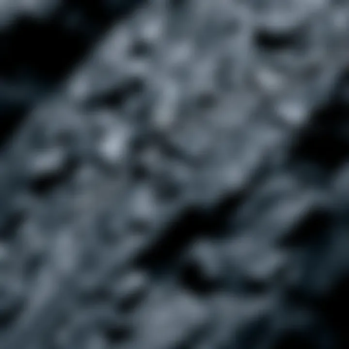 Close-Up of Smooth Black Rock Texture A close-up view of smooth black rock showcasing its shiny surface and unique texture.