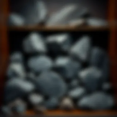 Collector's Display of Smooth Black Rocks A collection of smooth black rocks displayed in a collector's cabinet, highlighting their aesthetic appeal.