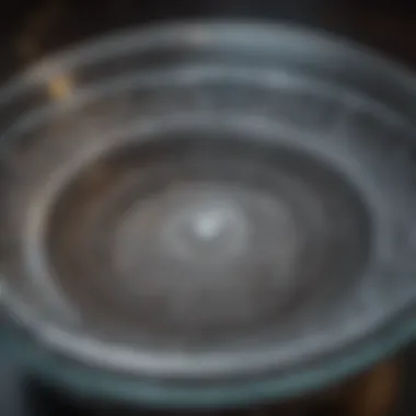 Close-up view of a crystal charging bowl showcasing intricate designs